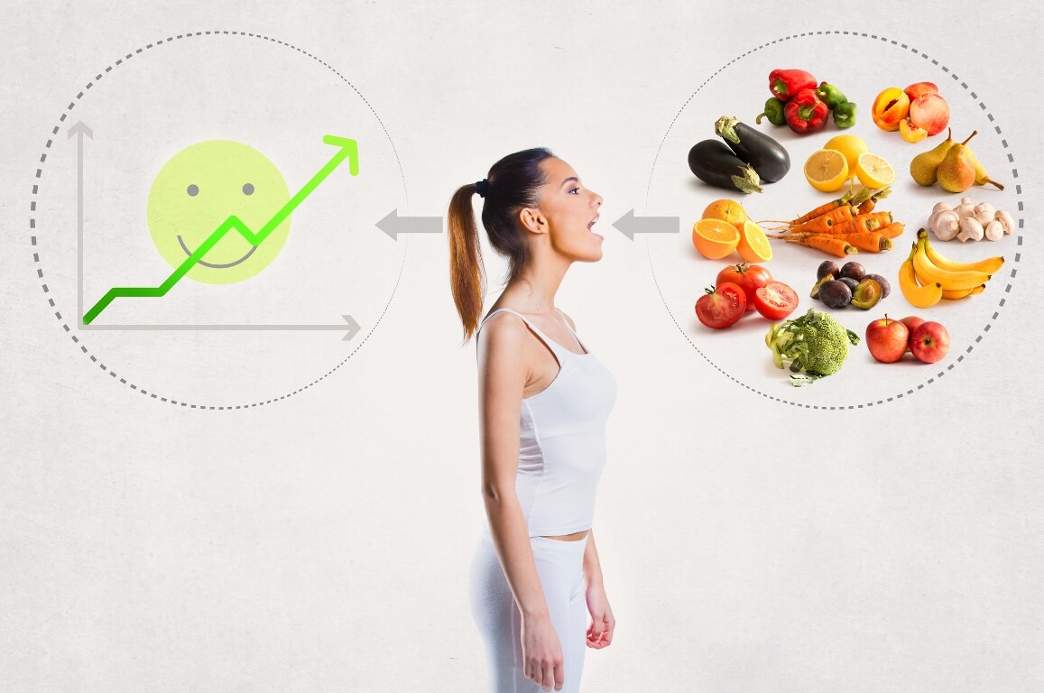 Young woman and a healthy diet concept over gray background  