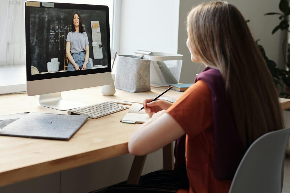 Girl Watching Video Using Imac.