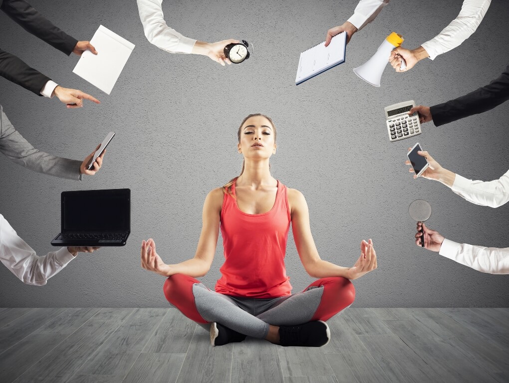 Woman tries to keep calm with yoga position due to stress and overwork at work